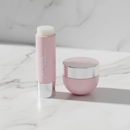 Medicube 5% Collagen Boost Balm stick and pink eye patch container set on marble surface